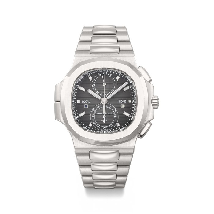 PATEK PHILIPPE. A LARGE AND ATTRACTIVE STAINLESS STEEL AUTOMATIC FLYBACK CHRONOGRAPH DUAL TIME WRISTWATCH WITH DAY/NIGHT INDICATOR, DATE, BRACELET, CERTIFICATE OF ORIGIN AND BOX SIGNED PATEK PHILIPPE, GENEVE, NAUTILUS MODEL, REF. 5990/1A-001, MOVEMENT NO. 7'157'487, CASE NO. 6'207'960, CIRCA 2018