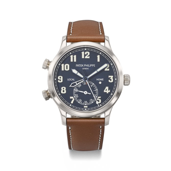PATEK PHILIPPE. AN ATTRACTIVE 18K WHITE GOLD AUTOMATIC DUAL TIME WRISTWATCH WITH SWEEP CENTRE SECONDS, DAY/NIGHT INDICATION, DATE, CERTIFICATE OF ORIGIN AND BOX SIGNED PATEK PHILIPPE, GENEVE, REF. 5524G-001, CALATRAVA PILOT TRAVEL TIME MODEL, MOVEMENT NO. 7'142'893, CASE NO. 6'257'111, CIRCA 2018
