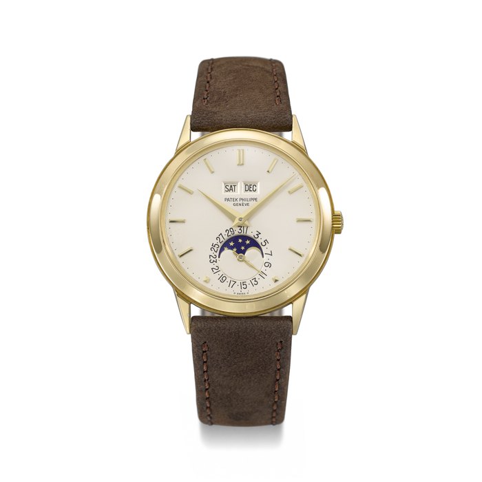 PATEK PHILIPPE. A RARE AND HIGHLY ATTRACTIVE 18K GOLD AUTOMATIC PERPETUAL CALENDAR WRISTWATCH WITH MOON PHASES SIGNED PATEK PHILIPPE, GENEVE, REF. 3448, MOVEMENT NO. 1'119'312, CASE NO. 330'588, MANUFACTURED IN 1973