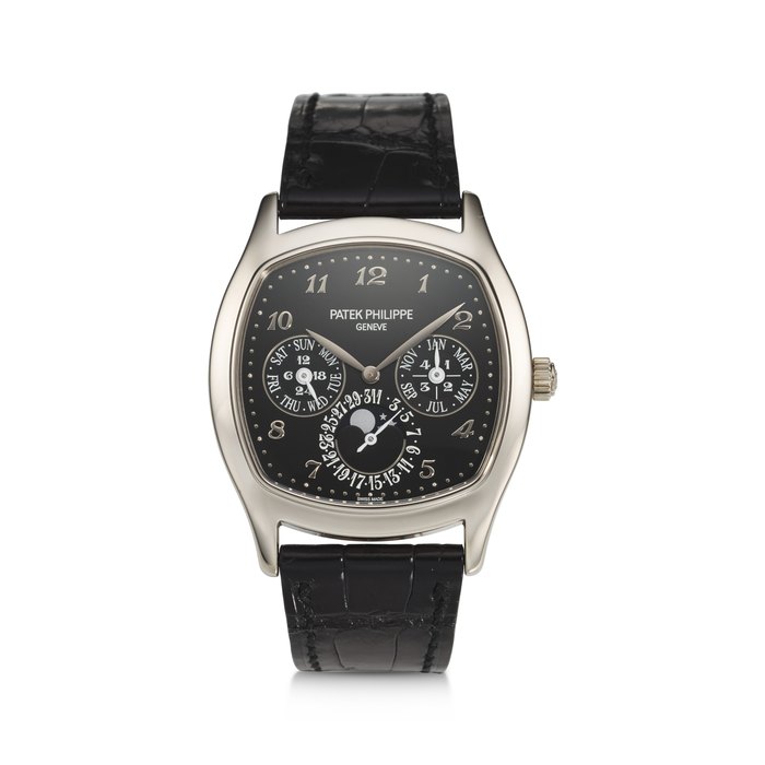 PATEK PHILIPPE, REF. 5940G-010, A FINE 18K WHITE GOLD TONNEAU SHAPED PERPETUAL CALENDAR WRISTWATCH WITH LEAP YEAR INDICATOR AND MOON PHASES