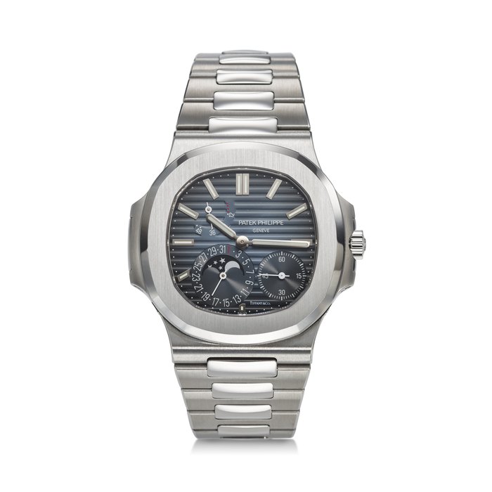 PATEK PHILIPPE, REF. 5712/1A-001, NAUTILUS, A VERY FINE AND RARE STEEL BRACELET WATCH WITH POWER RESERVE, MOON PHASES, AND DATE, SIGNED AND RETAILED BY TIFFANY & CO.
