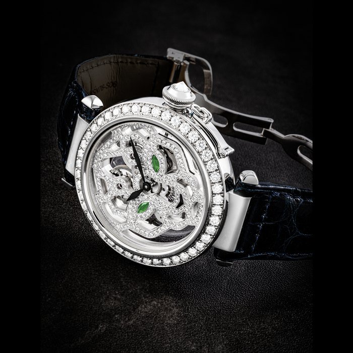 Cartier CARTIER. AN ATTRACTIVE 18K WHITE GOLD, DIAMOND, TSAVORITE AND ONYX-SET SKELETONISED WRISTWATCH HIGH JEWELLERY PASHA DE CARTIER SKELETON PANTHER DECOR, CIRCA 2010