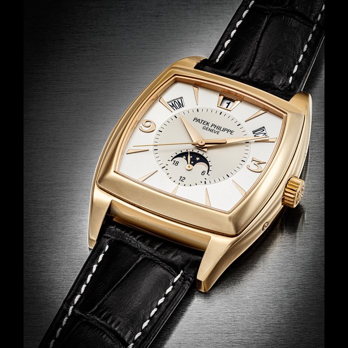PATEK PHILIPPE. AN 18K PINK GOLD CUSHION-SHAPED AUTOMATIC ANNUAL CALENDAR WRISTWATCH WITH SWEEP CENTRE SECONDS, MOON PHASES AND 24 HOUR INDICATION REF. 5135R, CIRCA 2006