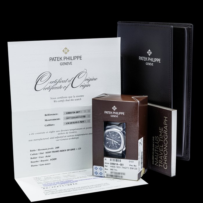 PATEK PHILIPPE. A STAINLESS STEEL AUTOMATIC FLYBACK CHRONOGRAPH DUAL TIME WRISTWATCH WITH DATE, DAY/NIGHT AND BRACELET, DOUBLE SEALED NAUTILUS, REF. 5990⁄1A, CIRCA 2015