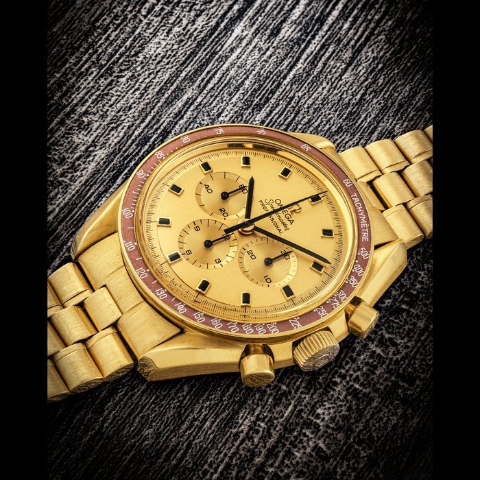 Omega OMEGA. A RARE 18K GOLD LIMITED EDITION CHRONOGRAPH WRISTWATCH WITH BRACELET AND GOLD DIAL SPEEDMASTER PROFESSIONAL MODEL, REF. BA 145022, APOLLO XI 1969, REF. BA 145022, SOLD IN 1970