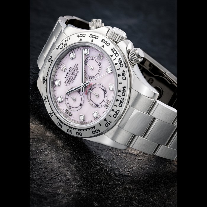 Rolex ROLEX. AN 18K WHITE GOLD AND DIAMOND-SET AUTOMATIC CHRONOGRAPH WRISTWATCH WITH BRACELET AND PINK MOTHER-OF-PEARL DIAL DAYTONA MODEL, REF. 116509, CIRCA 2007, Price & Market Data