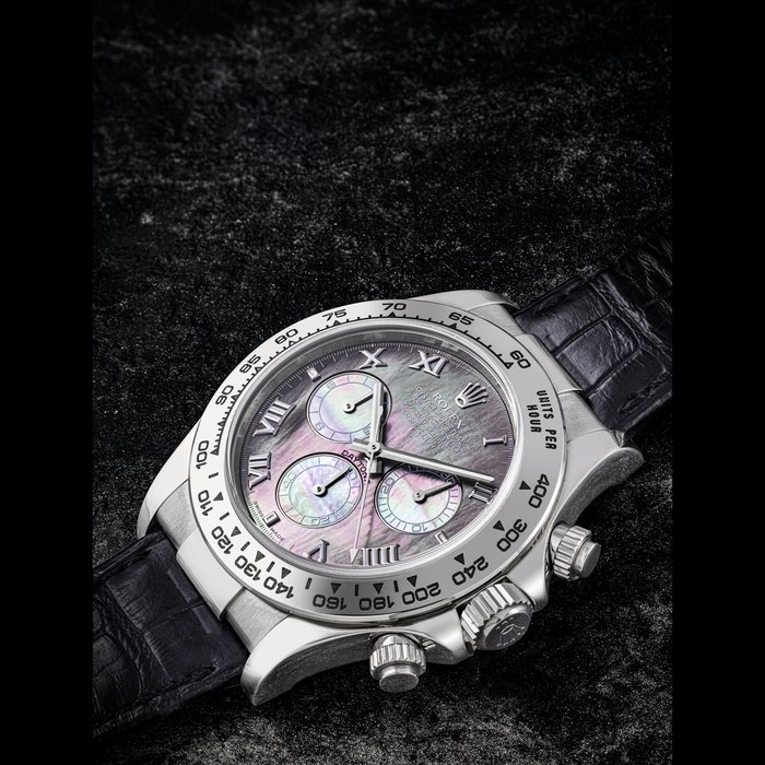 ROLEX. AN ATTRACTIVE 18K WHITE GOLD AUTOMATIC CHRONOGRAPH WRISTWATCH WITH MOTHER-OF-PEARL DIAL DAYTONA MODEL, REF. 116519, CIRCA 2005