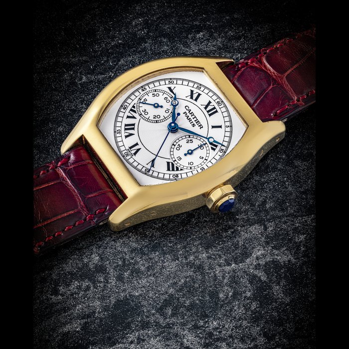 CARTIER. AN 18K GOLD TONNEAU SHAPED SINGLE BUTTON CHRONOGRAPH WRISTWATCH TORTUE MODEL, COLLECTION PRIVÉE CARTIER PARIS “CPCP“, CIRCA 2008