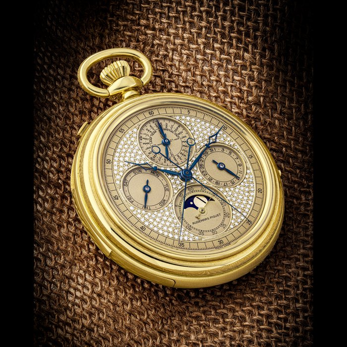 AUDEMARS PIGUET. A POSSIBLY UNIQUE 18K GOLD AND DIAMOND-SET MINUTE REPEATING PERPETUAL CALENDAR SPLIT SECONDS CHRONOGRAPH POCKET WATCH WITH LEAP YEAR INDICATOR AND MOON PHASES GRAND COMPLICATION, REF. 25630, CASE NUMBER 001, SOLD IN 1986 TO HONG KONG