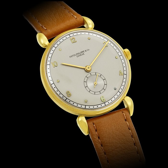 PATEK PHILIPPE. AN 18K GOLD WRISTWATCH WITH TWO TONE DIAL REF. 1461, MANUFACTURED IN 1942