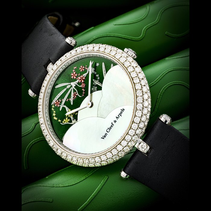VAN CLEEF AND ARPELS. A LADY’S UNIQUE AND ELEGANT 18K WHITE GOLD AND DIAMOND-SET WRISTWATCH WITH DATE AND MONTH INDICATOR, ENAMEL WITH FAIRY MOTIFS AND MOTHER-OF-PEARL DIAL REF. HH 17194
