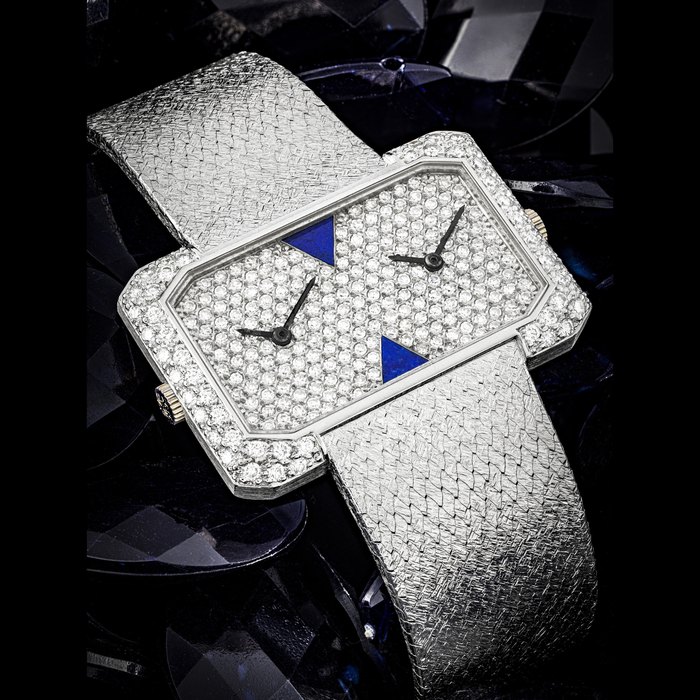 PATEK PHILIPPE. A VERY RARE 18K WHITE GOLD, DIAMOND AND LAPIS LAZULI-SET DUAL TIME BRACELET WATCH REF. 4404/3, MANUFACTURED IN 1976
