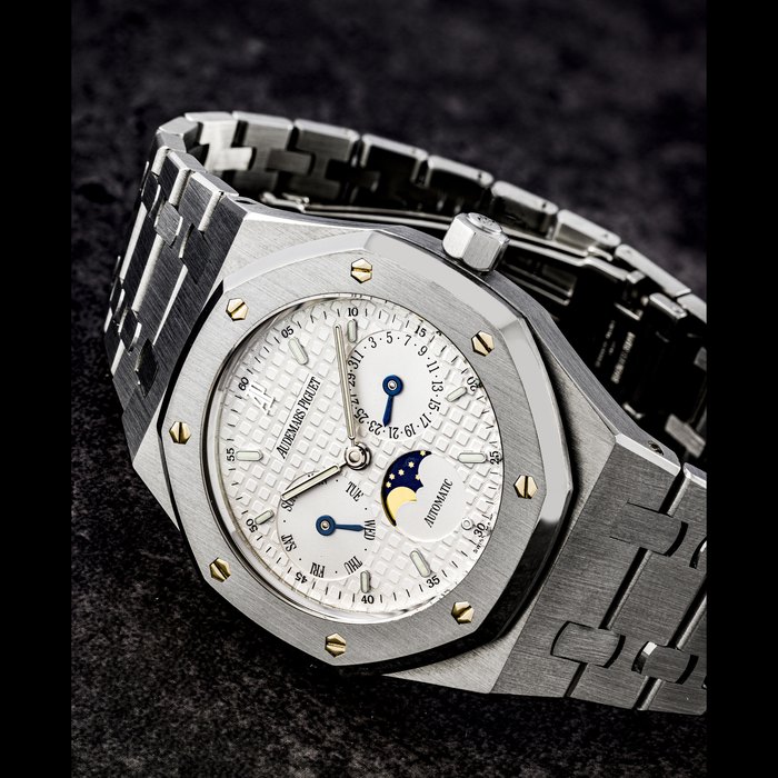 Audemars Piguet AUDEMARS PIGUET. A STAINLESS STEEL AUTOMATIC WRISTWATCH WITH DAY, DATE, MOON PHASES AND BRACELET ROYAL OAK MODEL, REF. 25594ST, Price & Market Data