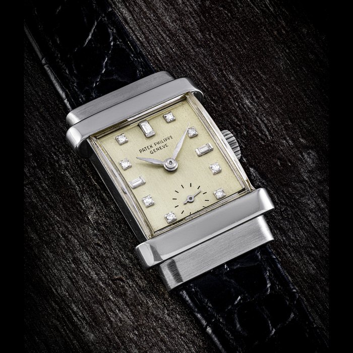 PATEK PHILIPPE. A RARE AND ELEGANT PLATINUM AND DIAMOND-SET RECTANGULAR WRISTWATCH REF. 1450, MANUFACTURED IN 1949