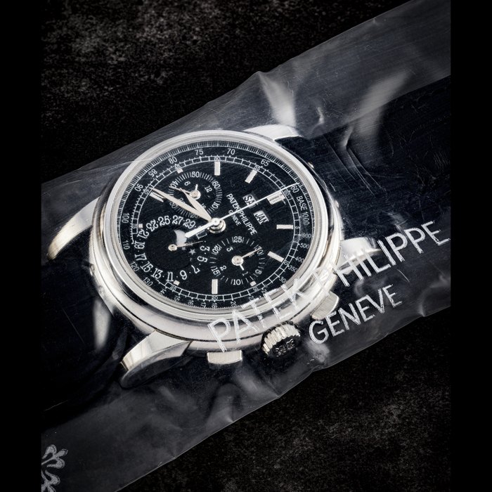 PATEK PHILIPPE. A PLATINUM PERPETUAL CALENDAR CHRONOGRAPH WRISTWATCH WITH MOON PHASES, 24-HOUR AND LEAP YEAR INDICATION, SINGLE SEALED REF. 5970P, CIRCA 2009