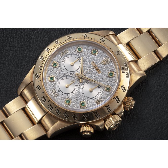 Rolex ROLEX, DAYTONA REF. 16528 'ZENITH', A GOLD, DIAMOND AND EMERALD-SET AUTOMATIC CHRONOGRAPH WRISTWATCH CASE NUMBER: X506’3XX · 16528