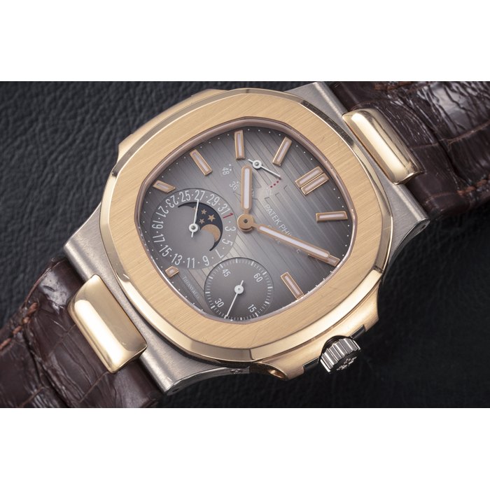 PATEK PHILIPPE, NAUTILUS REF. 5712GR ‘TIFFANY DIAL’, A TWO TONE GOLD AUTOMATIC WRISTWATCH WITH MOON-PHASE AND POWER RESERVE CASE NUMBER: 4’530’649, MOVEMENT NUMBER: 5’570’879