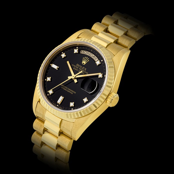 ROLEX, GOLD DAY-DATE WITH BLACK DIAL, REF. 18238
