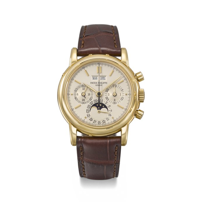 PATEK PHILIPPE. A RARE AND ATTRACTIVE 18K GOLD PERPETUAL CALENDAR CHRONOGRAPH WRISTWATCH WITH MOON PHASES, 24 HOUR INDICATION, LEAP YEAR INDICATION, CERTIFICATE OF ORIGIN AND BOX SIGNED PATEK PHILIPPE, GENEVE, REF. 3970E, SECOND SERIES, MOVEMENT NO. 875'297, CASE NO. 2'851'177, CIRCA 1990