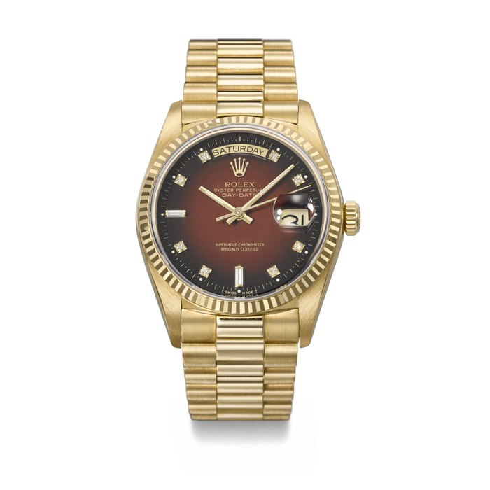 ROLEX. A RARE AND ATTRACTIVE 18K GOLD AND DIAMOND-SET AUTOMATIC WRISTWATCH WITH SWEEP CENTRE SECONDS, DAY, DATE, RED VIGNETTE DIAL AND BRACELET SIGNED ROLEX, DAY-DATE MODEL, REF. 18038, CASE NO. 9'380'306, CIRCA 1986