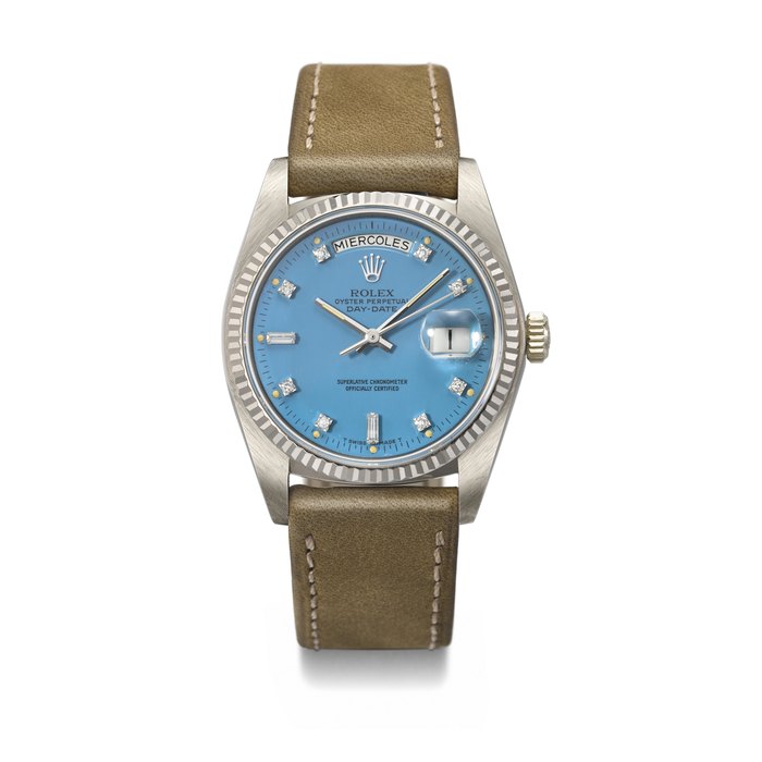 ROLEX. AN EXTREMELY RARE AND HIGHLY ATTRACTIVE 18K WHITE GOLD AND DIAMOND-SET AUTOMATIC WRISTWATCH WITH SWEEP CENTRE SECONDS, DAY, DATE AND BLUE LACQUERED 'STELLA' DIAL SIGNED ROLEX, DAY-DATE MODEL, REF. 18039, CASE NO. 7'308'476, CIRCA 1982