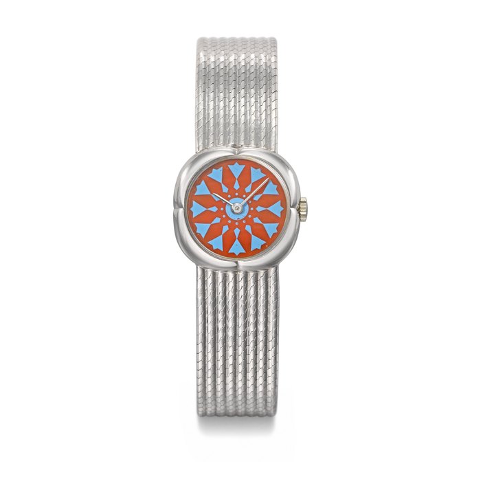 GERALD GENTA. A POSSIBLY UNIQUE 18K WHITE GOLD WRISTWATCH WITH CORAL DIAL AND BRACELET, MADE FOR HIS MAJESTY KING HASSAN II OF MOROCCO SIGNED GERALD GENTA, NO. 4491, CIRCA 1980