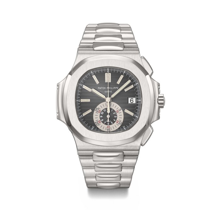 PATEK PHILIPPE. AN ATTRACTIVE STAINLESS STEEL AUTOMATIC FLYBACK CHRONOGRAPH WRISTWATCH WITH DATE AND BRACELET SIGNED PATEK PHILIPPE, GENEVE, NAUTILUS MODEL, REF. 5980/1A-001, MOVEMENT NO. 3'669'669, CASE NO. 4'445'020, CIRCA 2009