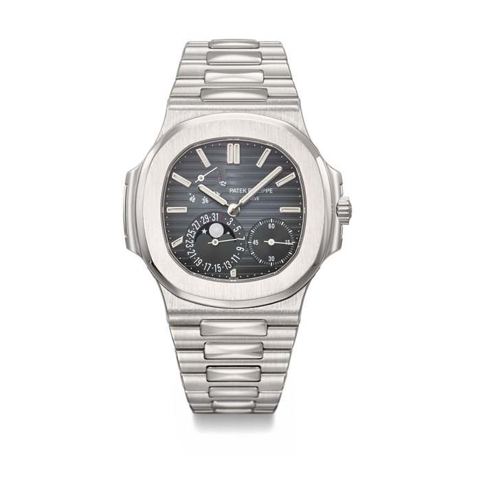 PATEK PHILIPPE. AN ATTRACTIVE STAINLESS STEEL AUTOMATIC WRISTWATCH WITH DATE, MOON PHASES, POWER RESERVE AND BRACELET SIGNED PATEK PHILIPPE, GENEVE, NAUTILUS MODEL, REF. 5712/1A-001, MOVEMENT NO. 5'503'801, CASE NO. 4'489'588, CIRCA 2009
