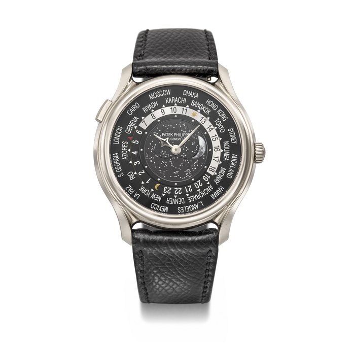 PATEK PHILIPPE. A RARE 18K WHITE GOLD LIMITED EDITION AUTOMATIC WORLD TIME WRISTWATCH WITH MOON PHASES, MADE TO COMMEMORATE THE 175TH ANNIVERSARY OF PATEK PHILIPPE IN 2014 SIGNED PATEK PHILIPPE, GENEVE, REF. 5575G-001, MOVEMENT NO. 5'894'218, CASE NO. 6'026'215, CIRCA 2015