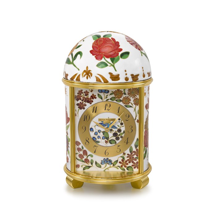 PATEK PHILIPPE. A UNIQUE AND HIGHLY ATTRACTIVE PORCELAIN AND GILT BRASS DOME TABLE CLOCK WITH CLOISONNÉ ENAMEL DEPICTING FLOWERS AND FOLIAGES SIGNED PATEK PHILIPPE, GENEVE, DOME 'NYMPHENBURG PORCELAIN', REF. 1660M, CASE NO. 1'804'962, MANUFACTURED IN 2013