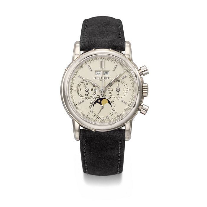 PATEK PHILIPPE. A RARE 18K WHITE GOLD PERPETUAL CALENDAR CHRONOGRAPH WRISTWATCH WITH MOON PHASES, 24 HOUR INDICATION AND LEAP YEAR INDICATION SIGNED PATEK PHILIPPE, GENEVE, REF. 3970EG, MOVEMENT NO. 875'847, CASE NO. 2'895'989, CIRCA 1991
