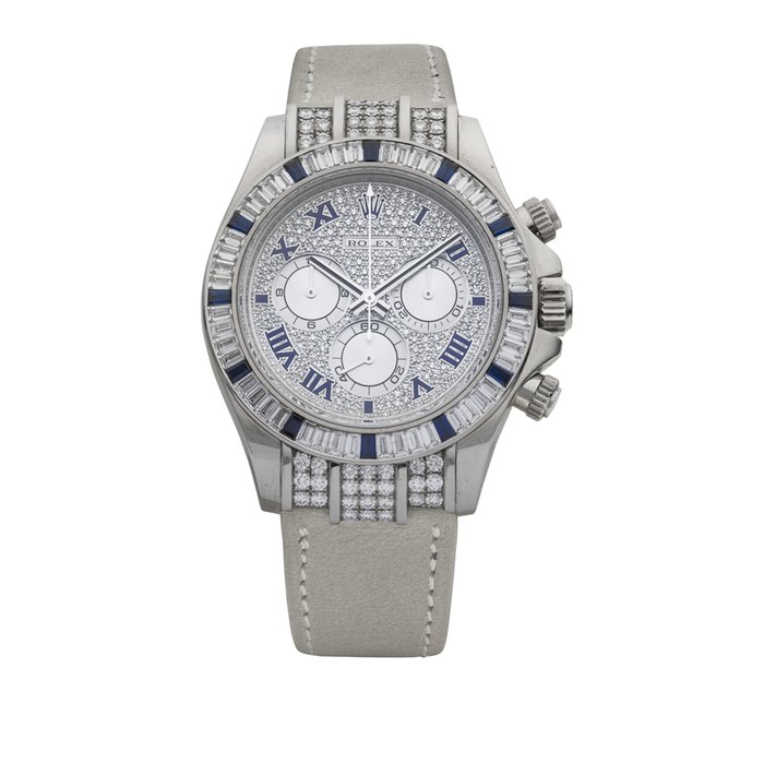 ROLEX. A SUPERB AND ATTRACTIVE 18K WHITE GOLD, DIAMOND AND SAPPHIRE-SET AUTOMATIC CHRONOGRAPH WRISTWATCH SIGNED ROLEX, DAYTONA MODEL, REF. 116599, CASE NO. M192772, CIRCA 2007