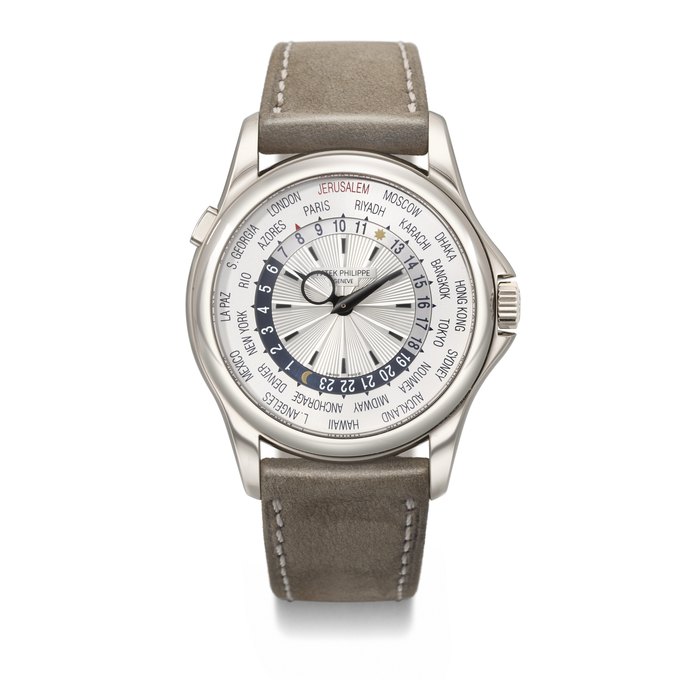 PATEK PHILIPPE. AN EXTREMELY RARE AND COVETED 18K WHITE GOLD AUTOMATIC WORLD TIME WRISTWATCH SIGNED PATEK PHILIPPE, GENEVE , REF. 5130G-023, MOVEMENT NO. 5'841'637, CASE NO. 4'694'715, CIRCA 2014
