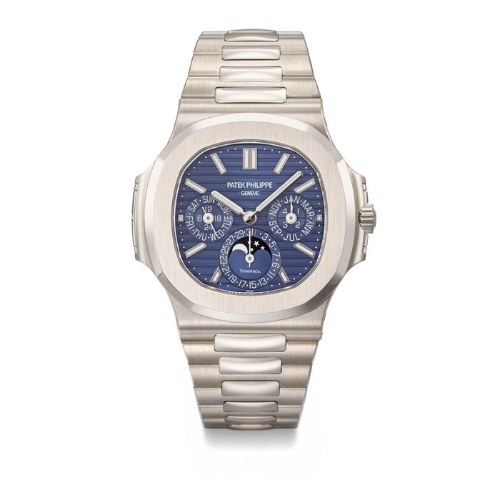 PATEK PHILIPPE. AN EXTREMELY RARE AND COVETED 18K WHITE GOLD AUTOMATIC PERPETUAL CALENDAR WRISTWATCH WITH MOON PHASES, 24 HOUR, LEAP YEAR INDICATION AND BRACELET SIGNED PATEK PHILIPPE, GENEVE, RETAILED BY TIFFANY & CO., NAUTILUS MODEL, REF. 5740/1G-001, MOVEMENT NO. 7'352'515, CASE NO. 6'401'929, CIRCA 2021