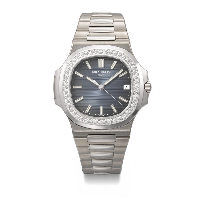 PATEK PHILIPPE. A VERY RARE AND ATTRACTIVE 18K WHITE GOLD AND DIAMOND-SET AUTOMATIC WRISTWATCH WITH SWEEP CENTRE SECONDS, DATE AND BRACELET SIGNED PATEK PHILIPPE, GENEVE, NAUTILUS MODEL, REF. 5713/1G-001, MOVEMENT NO. 3'982'146, CASE NO. 4'479'857, CIRCA 2009