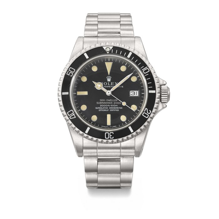 ROLEX. A VERY RARE AND ATTRACTIVE STAINLESS STEEL AUTOMATIC WRISTWATCH WITH SWEEP CENTRE SECONDS, GAS ESCAPE VALVE, DATE, BRACELET AND 'PATENT PENDING' CASE SIGNED ROLEX, SEA-DWELLER, SUBMARINER 2000, DOUBLE-RED MODEL, REF. 1665, CASE NO. 2'117'441, CIRCA 1969