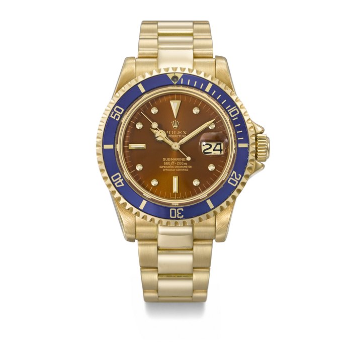 ROLEX. A RARE AND HIGHLY ATTRACTIVE 18K GOLD AUTOMATIC WRISTWATCH WITH SWEEP CENTRE SECONDS, DATE, TROPICAL DIAL AND BRACELET SIGNED ROLEX, SUBMARINER MODEL, REF. 1680, CASE NO. 5'259'041, CIRCA 1978