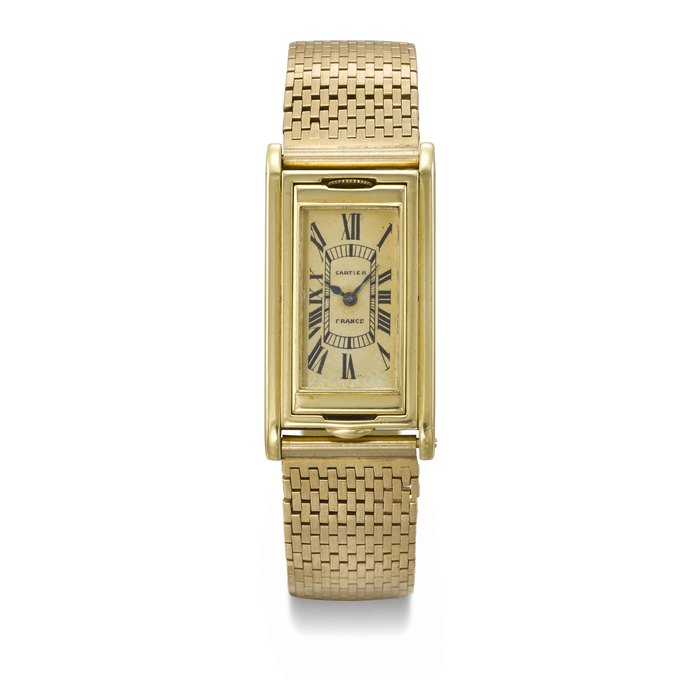 CARTIER. AN EXTREMELY RARE 18K GOLD RECTANGULAR REVERSIBLE WRISTWATCH SIGNED CARTIER, TANK BASCULANTE MODEL, MOVEMENT SIGNED EUROPEAN WATCH AND CLOCK CO. INC., CASE NOS. 29684/15365/07967, CIRCA 1936
