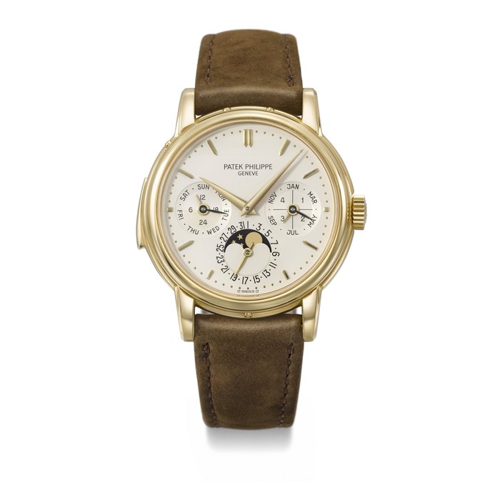 PATEK PHILIPPE. A VERY RARE AND COVETED 18K GOLD AUTOMATIC MINUTE REPEATING PERPETUAL CALENDAR WRISTWATCH WITH MOON PHASES, 24 HOUR, LEAP YEAR AND DAY/NIGHT INDICATION SIGNED PATEK PHILIPPE, GENEVE, REF. 3974, MOVEMENT NO. 1'906'057, CASE NO. 2'900'797, CIRCA 1990