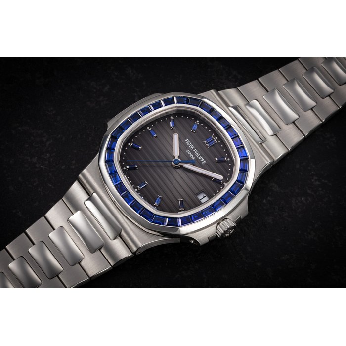 Patek Philippe PATEK PHILIPPE, NAUTILUS REF. 5711/111P-001, AN EXCLUSIVE PLATINUM WRISTWATCH WITH SAPPHIRE-SET BEZEL CASE NUMBER: 6’29*'***, Price & Market Data