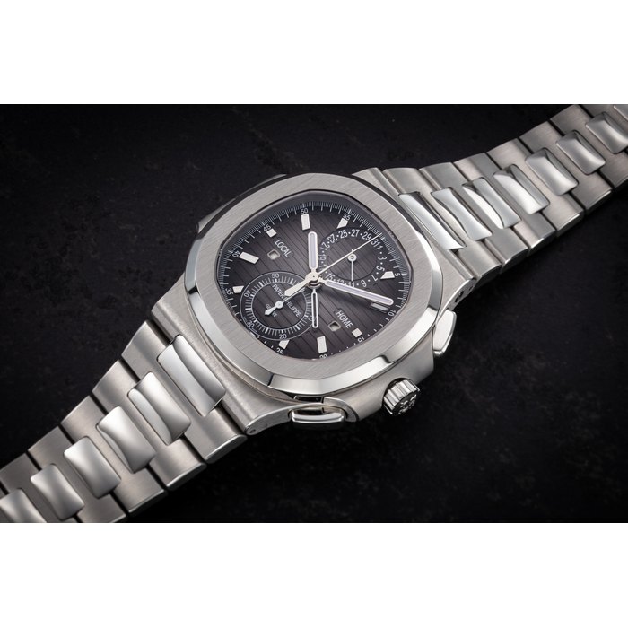 PATEK PHILIPPE, REF. 5990/1A, A FINE STEEL AUTOMATIC DUAL TIME FLYBACK CHRONOGRAPH CASE NUMBER: 6'285'***