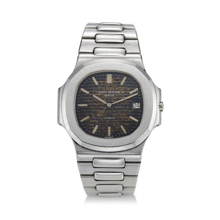 PATEK PHILIPPE, REF. 3700/1, NAUTILUS, A HIGHLY ATTRACTIVE AND RARE STEEL BRACELET WATCH WITH “TROPICAL” MK I DIAL, RETAILED BY GÜBELIN