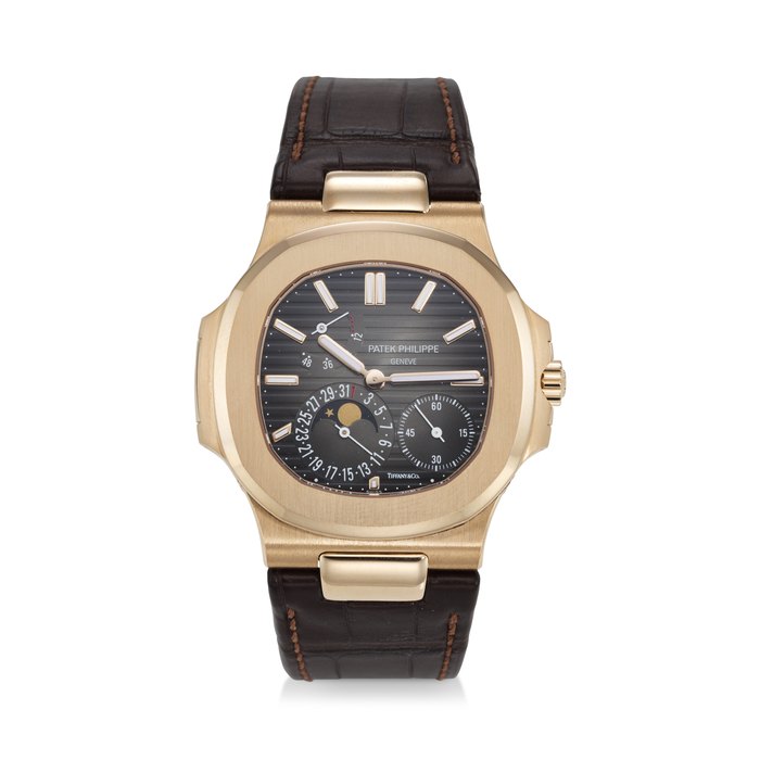 PATEK PHILIPPE, REF. 5712R-001 SIGNED AND RETAILED BY TIFFANY & CO., NAUTILUS, A RARE 18K ROSE GOLD WRISTWATCH WITH POWER RESERVE, MOON PHASES, AND DATE