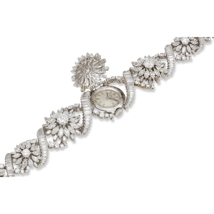 PATEK PHILIPPE, REF. 3215/39, AN EXTREMELY RARE AND IMPRESSIVE PLATINUM AND DIAMOND-SET BRACELET WATCH WITH HINGED COVER, THE ONLY KNOWN EXAMPLE