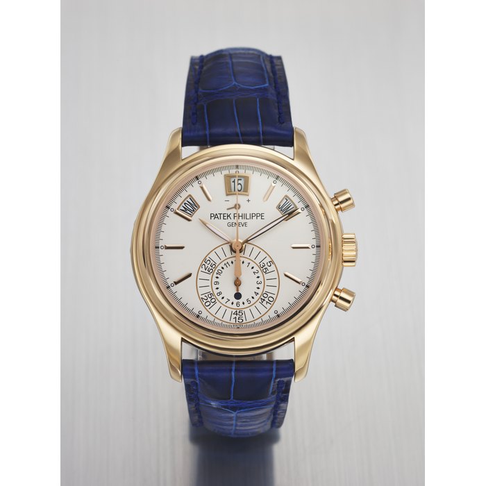PATEK PHILIPPE. AN ATTRACTIVE 18K PINK GOLD AUTOMATIC ANNUAL CALENDAR FLYBACK CHRONOGRAPH WRISTWATCH WITH POWER RESERVE AND DAY/NIGHT INDICATOR SIGNED PATEK PHILIPPE, GENEVE, REF. 5960R-011, MOVEMENT NO. 5'700'889, CASE NO. 4'589'065, CIRCA 2012
