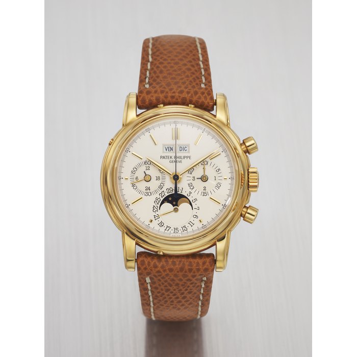 PATEK PHILIPPE. A VERY RARE AND ATTRACTIVE 18K GOLD PERPETUAL CALENDAR CHRONOGRAPH WRISTWATCH WITH MOON PHASES, 24 HOUR INDICATION AND LEAP YEAR INDICATION SIGNED PATEK PHILIPPE, GENEVE, REF. 3970E, MOVEMENT NO. 875'155, CASE NO. 2'840'116, CIRCA 1988