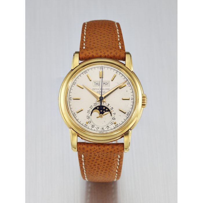 PATEK PHILIPPE. AN EXTREMELY RARE AND IMPORTANT 18K GOLD PERPETUAL CALENDAR WRISTWATCH WITH SWEEP CENTRE SECONDS, MOON PHASES AND SCREW-DOWN CASEBACK SIGNED PATEK PHILIPPE, GENEVE, REF. 2438/1, MOVEMENT NO. 888'145, CASE NO. 2'602'745, MANUFACTURED IN 1958