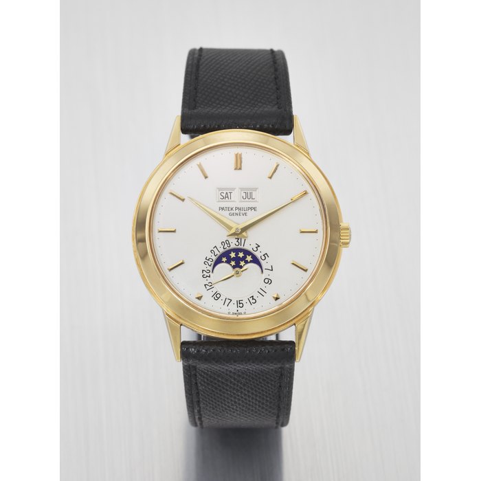 PATEK PHILIPPE. A VERY RARE AND HIGHLY IMPORTANT 18K GOLD AUTOMATIC PERPETUAL CALENDAR WRISTWATCH WITH MOON PHASES, FORMERLY TO PROPERTY OF ANDY WARHOL SIGNED PATEK PHILIPPE, GENEVE, REF. 3448, MOVEMENT NO. 1'119'511, CASE NO. 332'869, MANUFACTURED IN 1977