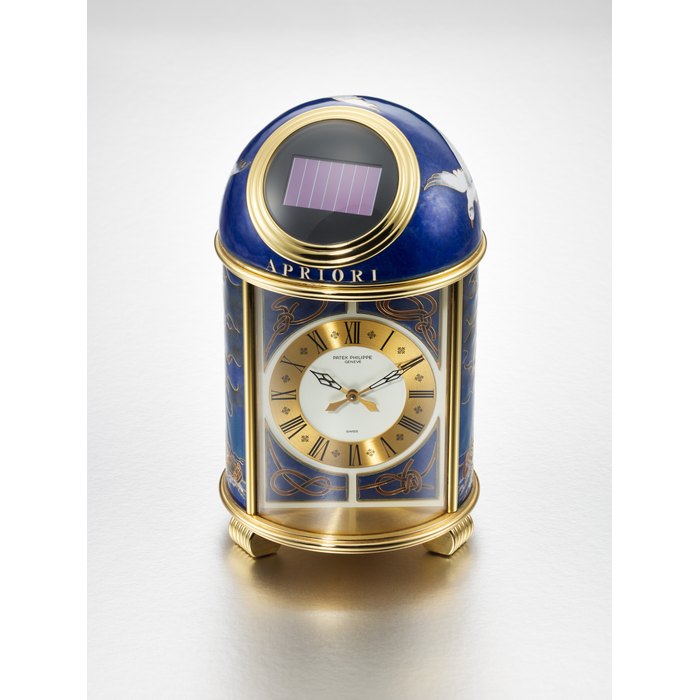 PATEK PHILIPPE. A UNIQUE AND HIGHLY ATTRACTIVE GILDED BRASS SOLAR-POWERED TABLE CLOCK WITH 'APRIORI' CLOISONNÉ ENAMEL DECORATION SIGNED PATEK PHILIPPE, GENEVE, 'APRIORI' DOME CLOCK, REF. 1422M, CASE NO. 1’804'692, CIRCA 1995