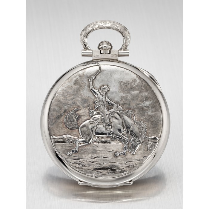 PATEK PHILIPPE. AN EXTREMELY ATTRACTIVE AND UNIQUE 18K WHITE GOLD OPEN FACE KEYLESS LEVER WATCH WITH ENAMEL DIAL, POWER RESERVE AND HAND-ENGRAVED CASE BACK, MADE FOR THE RARE HANDCRAFTS COLLECTION IN 2013 SIGNED PATEK PHILIPPE, GENEVE, REF. 982/157G-001, MOVEMENT NO. 5'632'885, CASE NO. 45'931'211, CIRCA 2013